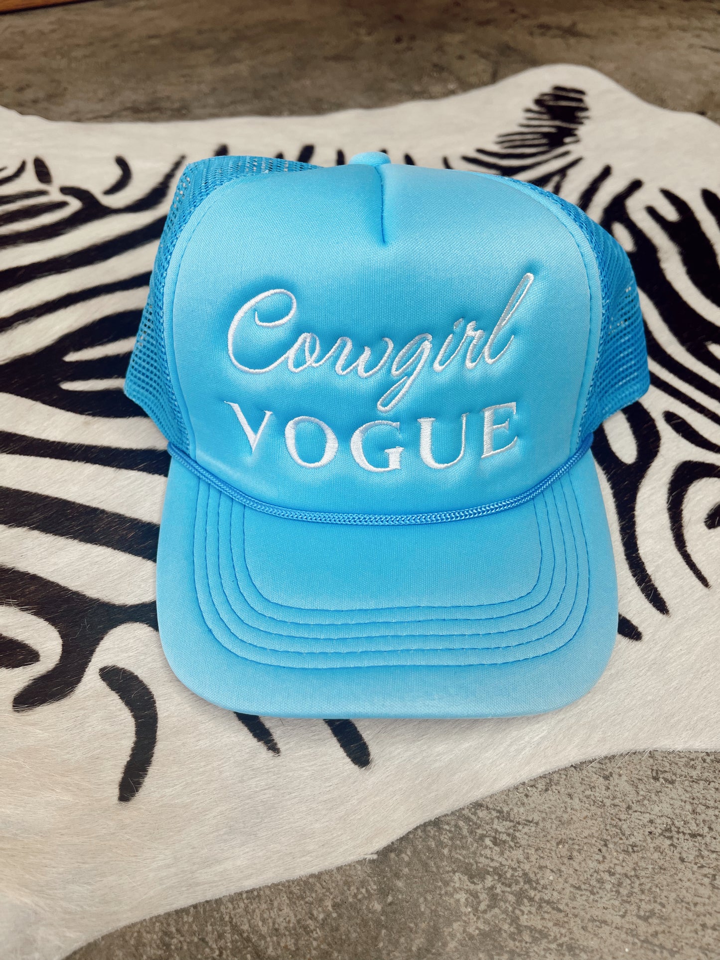 The Cowgirl Vogue Trucker Hat in Blue