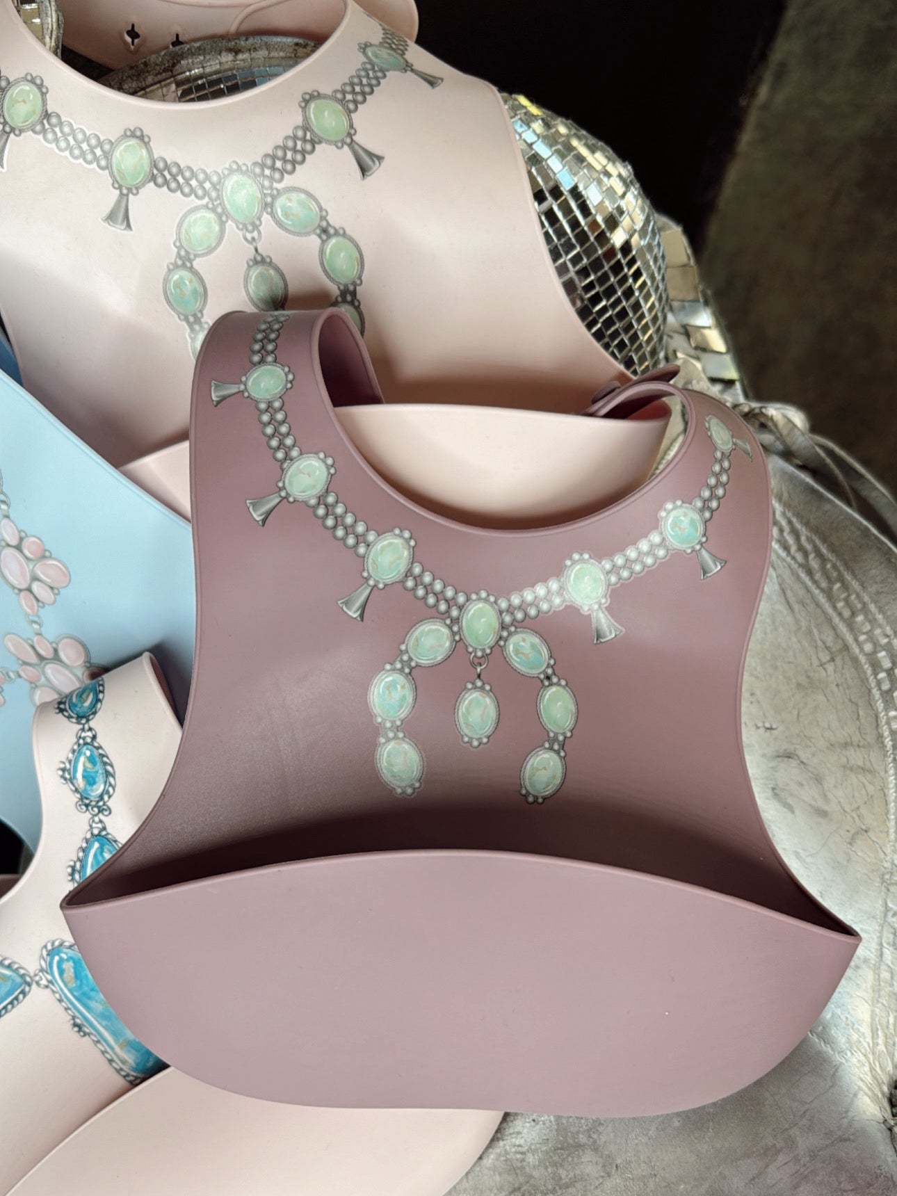 The Turquoise Squash Silicone Bib in Purple