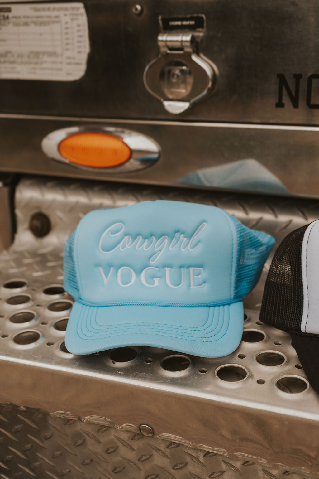 The Cowgirl Vogue Trucker Hat in Blue