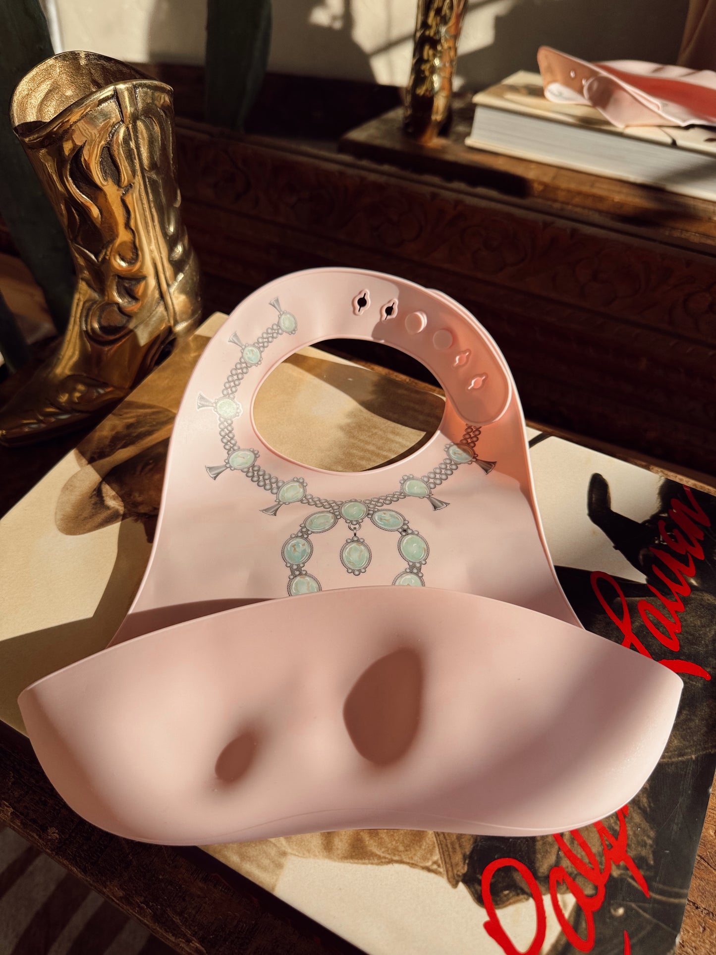 The Turquoise Squash Silicone Bib in Pink