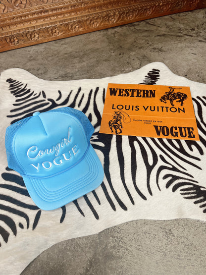 The Cowgirl Vogue Trucker Hat in Blue