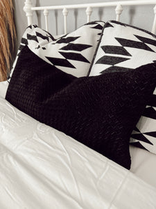 The Woven Suede Lumbar Pillow in Black